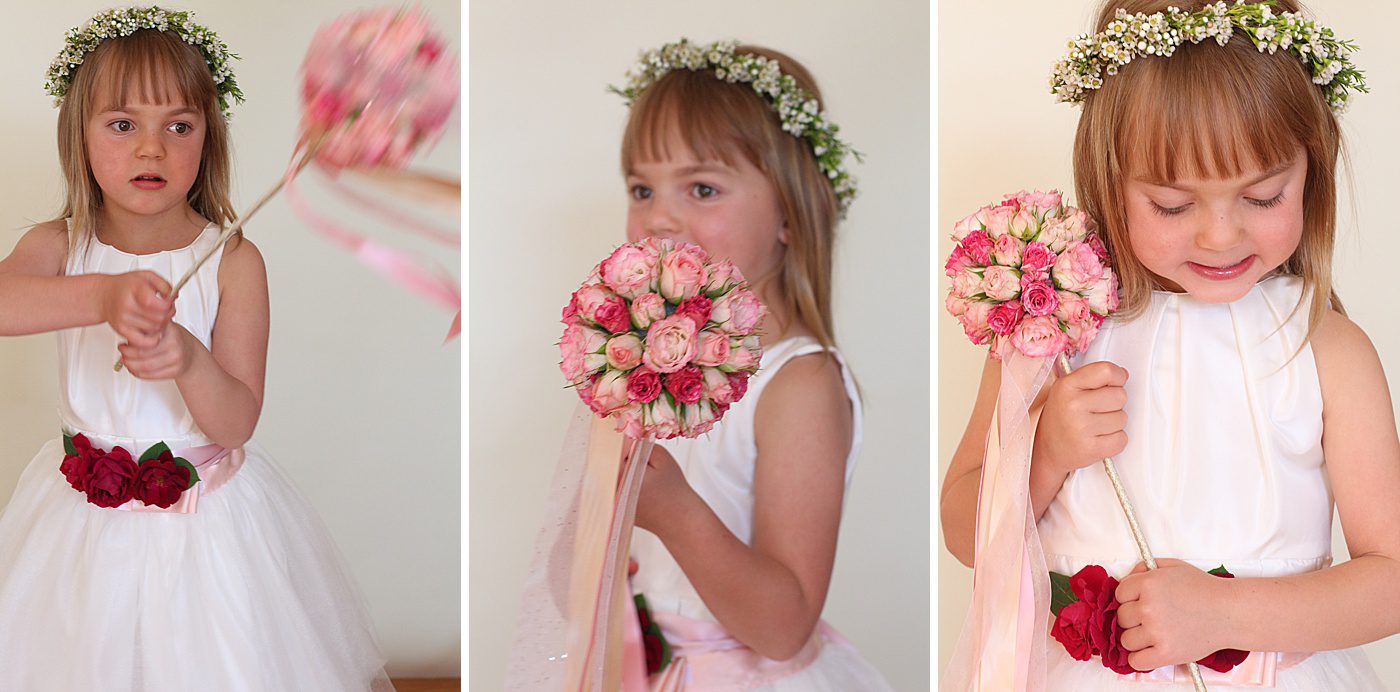 a flower girl playing with her flower wand