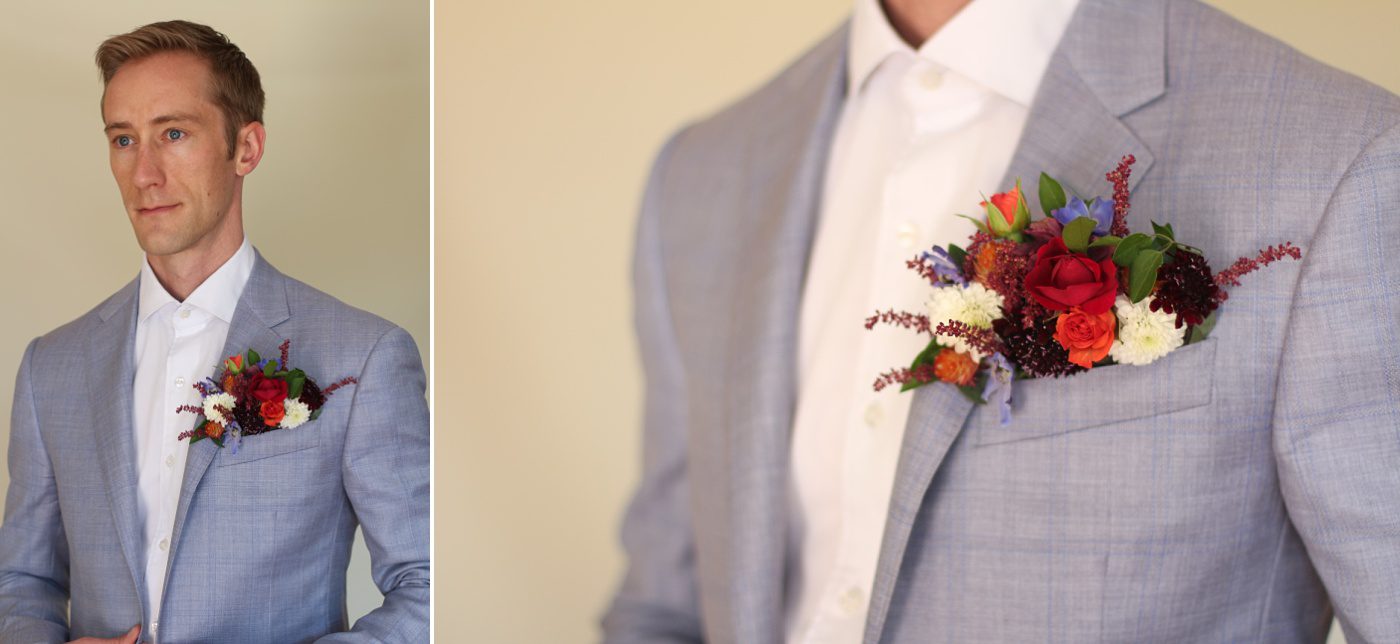 man wearing colorful flowers in his pocket square