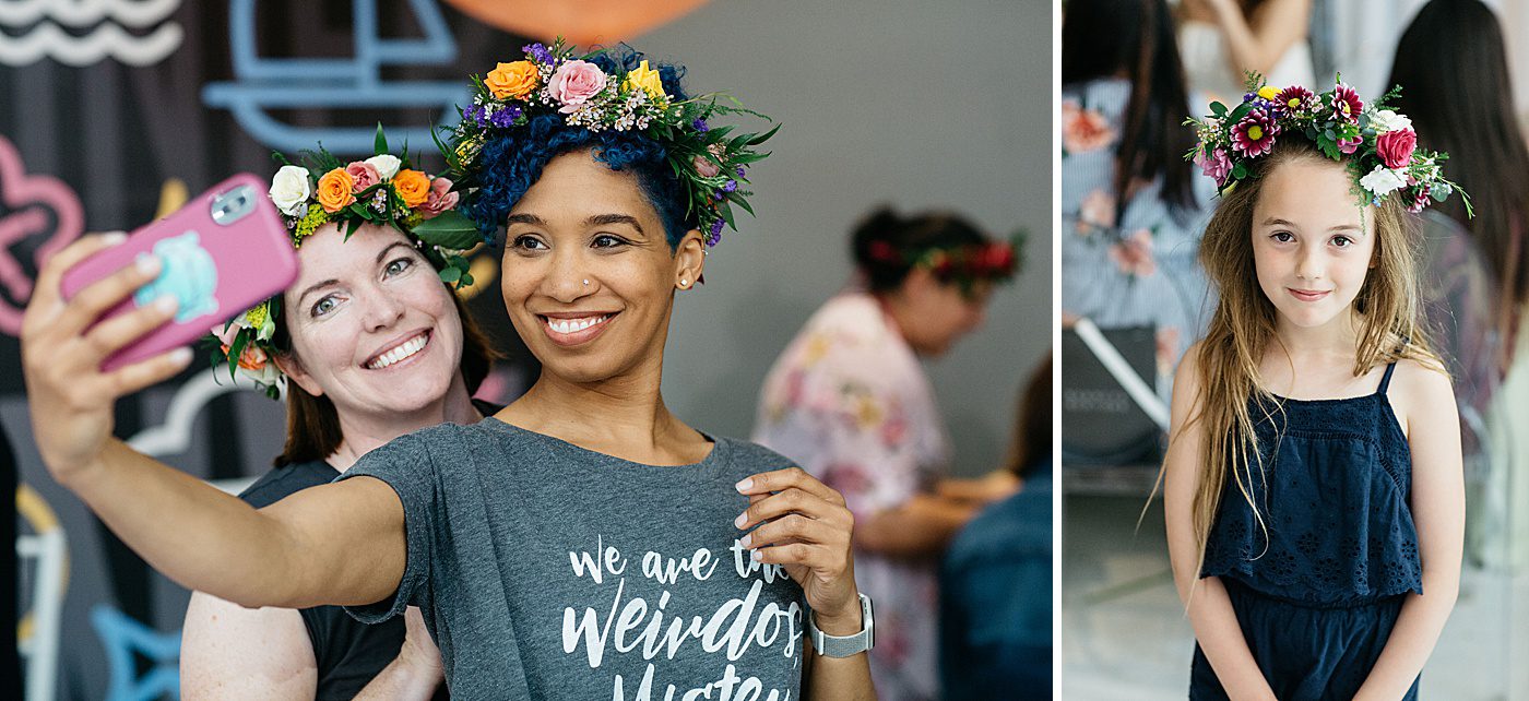 women wearing flower crowns and taking selfies