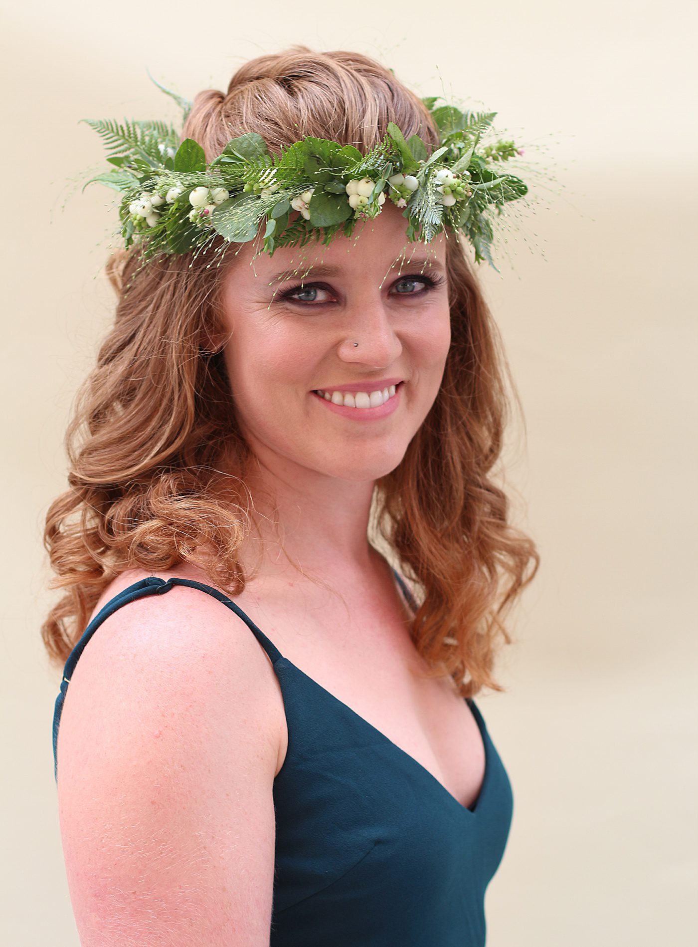 bride wearing greenery crown