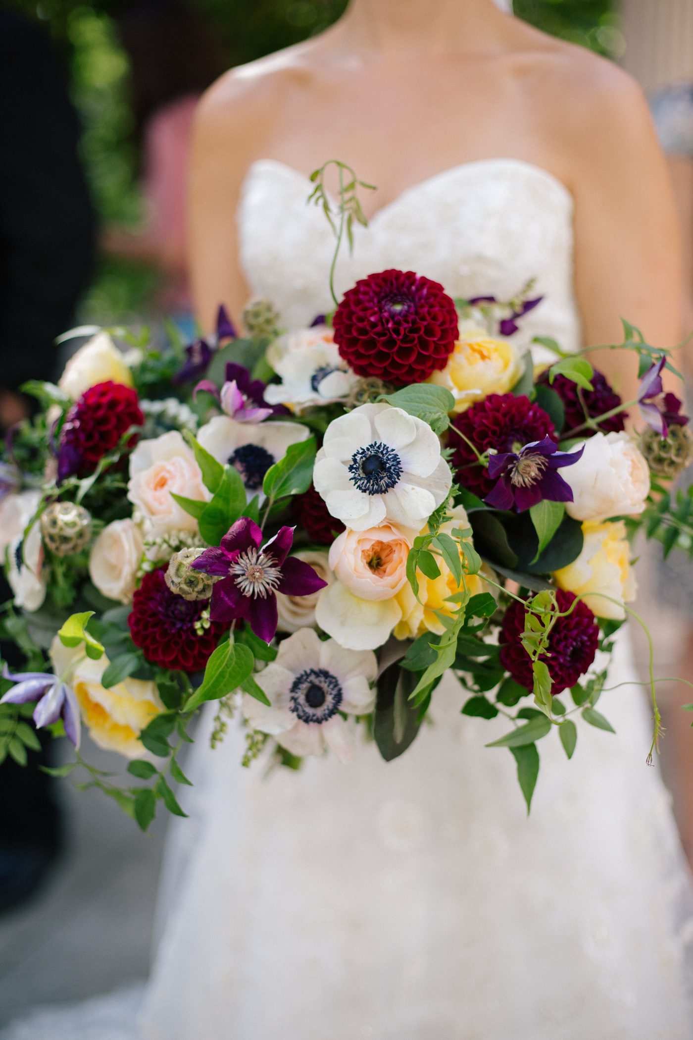 colorful bridal bouquet with burgundy dahlias