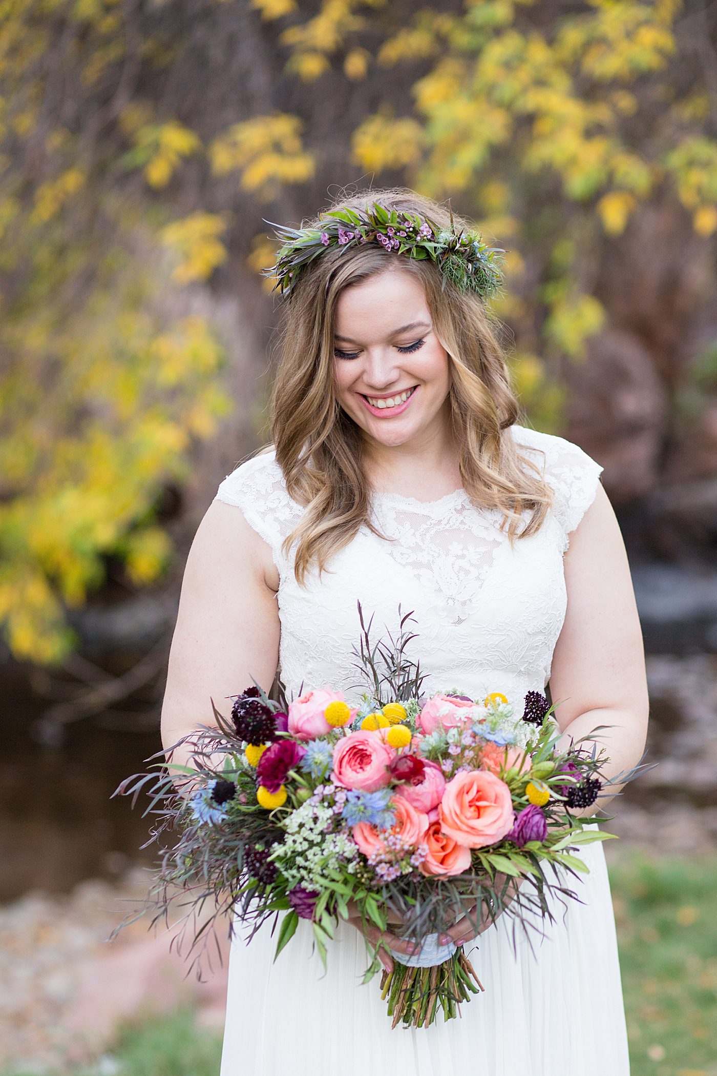 bride holding a colorful wedding bouquet