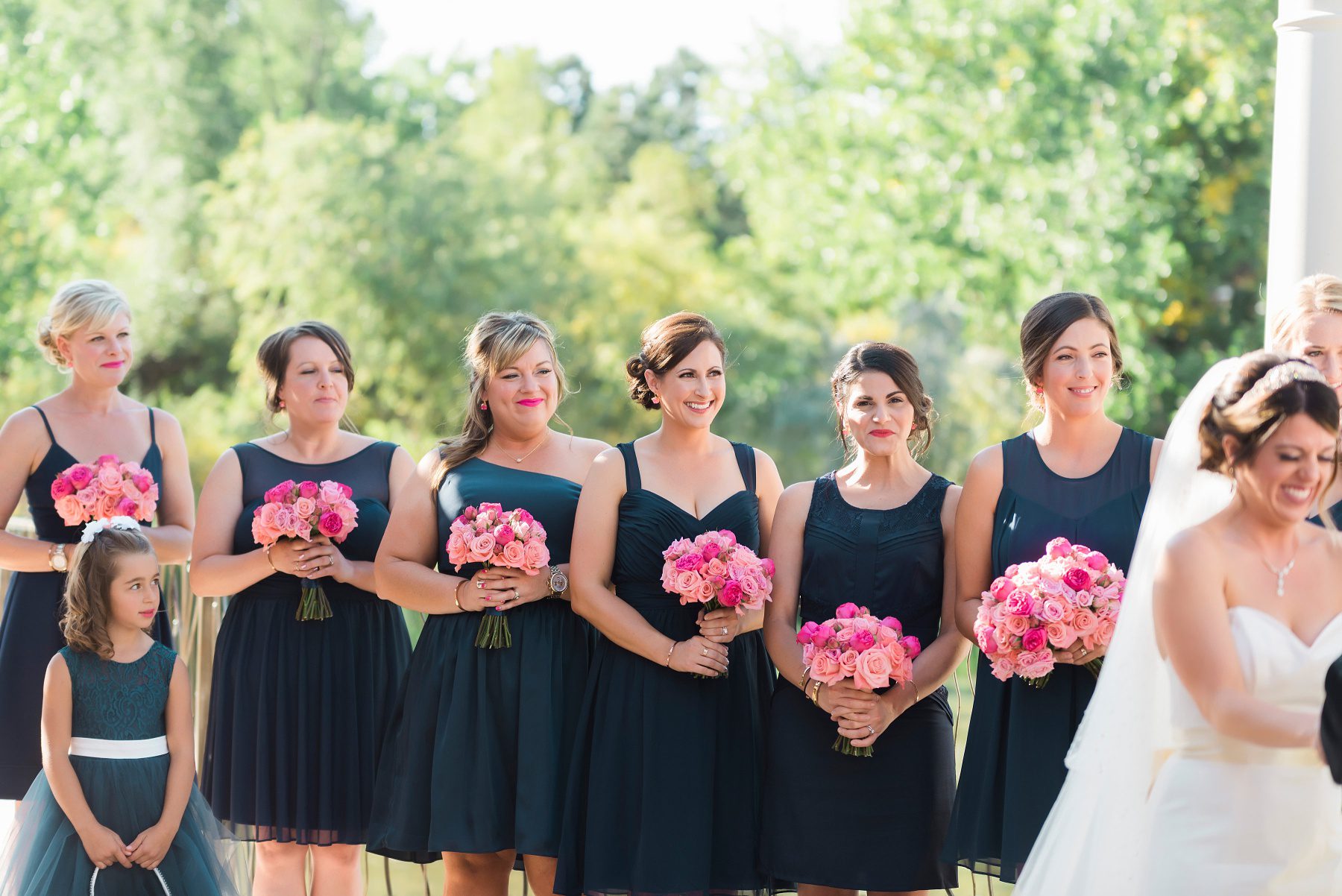 bridesmaids holding pink bouquets