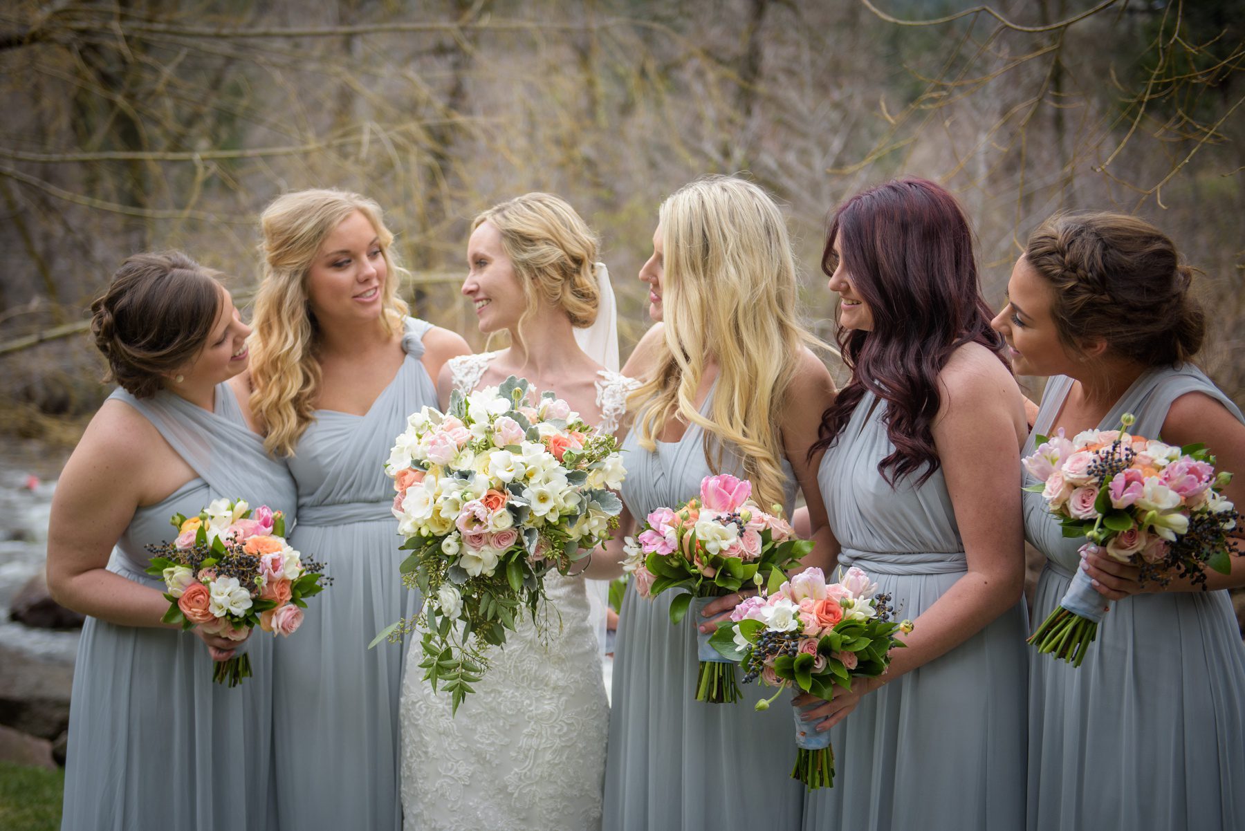 bridal party holding spring bouquets