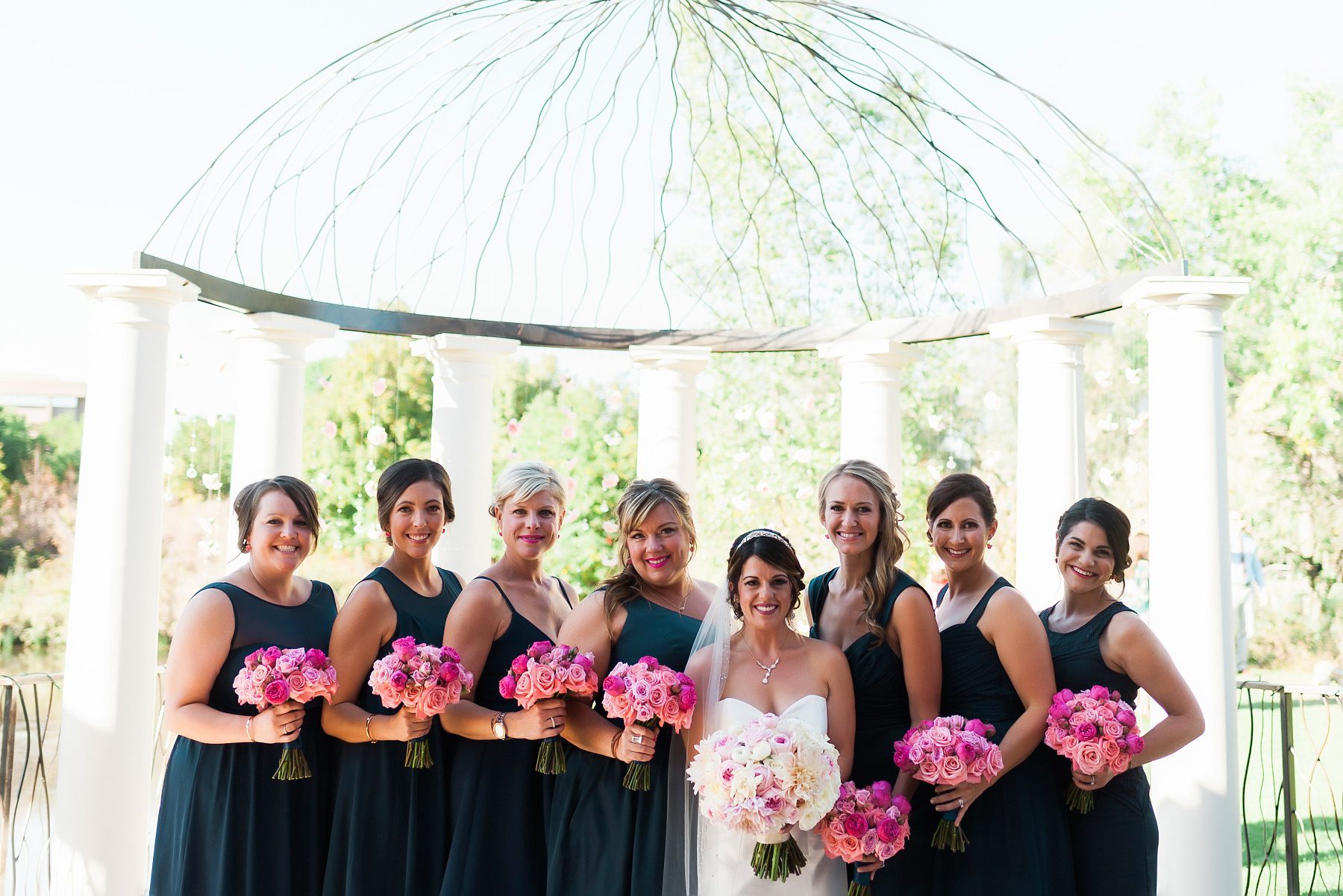 bridal party with hot pink bouquets