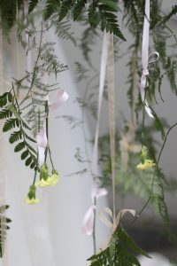 bridal bouquet with hanging ribbons, flowers, and ferns