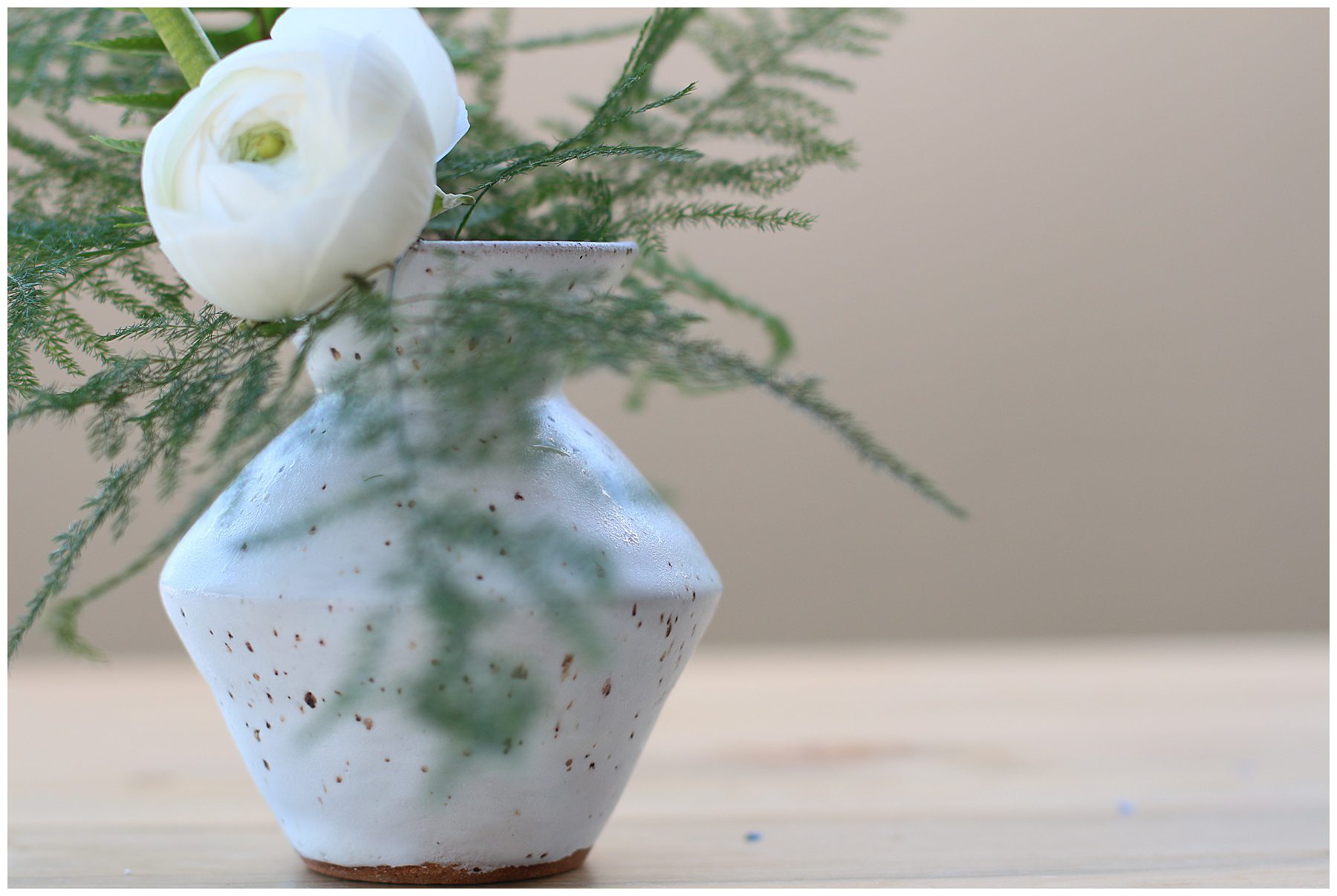 white ceramic bud vase