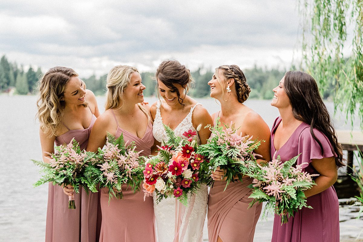 bride and bridesmaids with lush pink bouquets