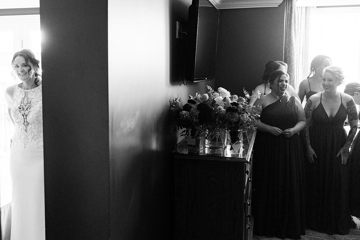 a bride waiting in another room to see her bridesmaids