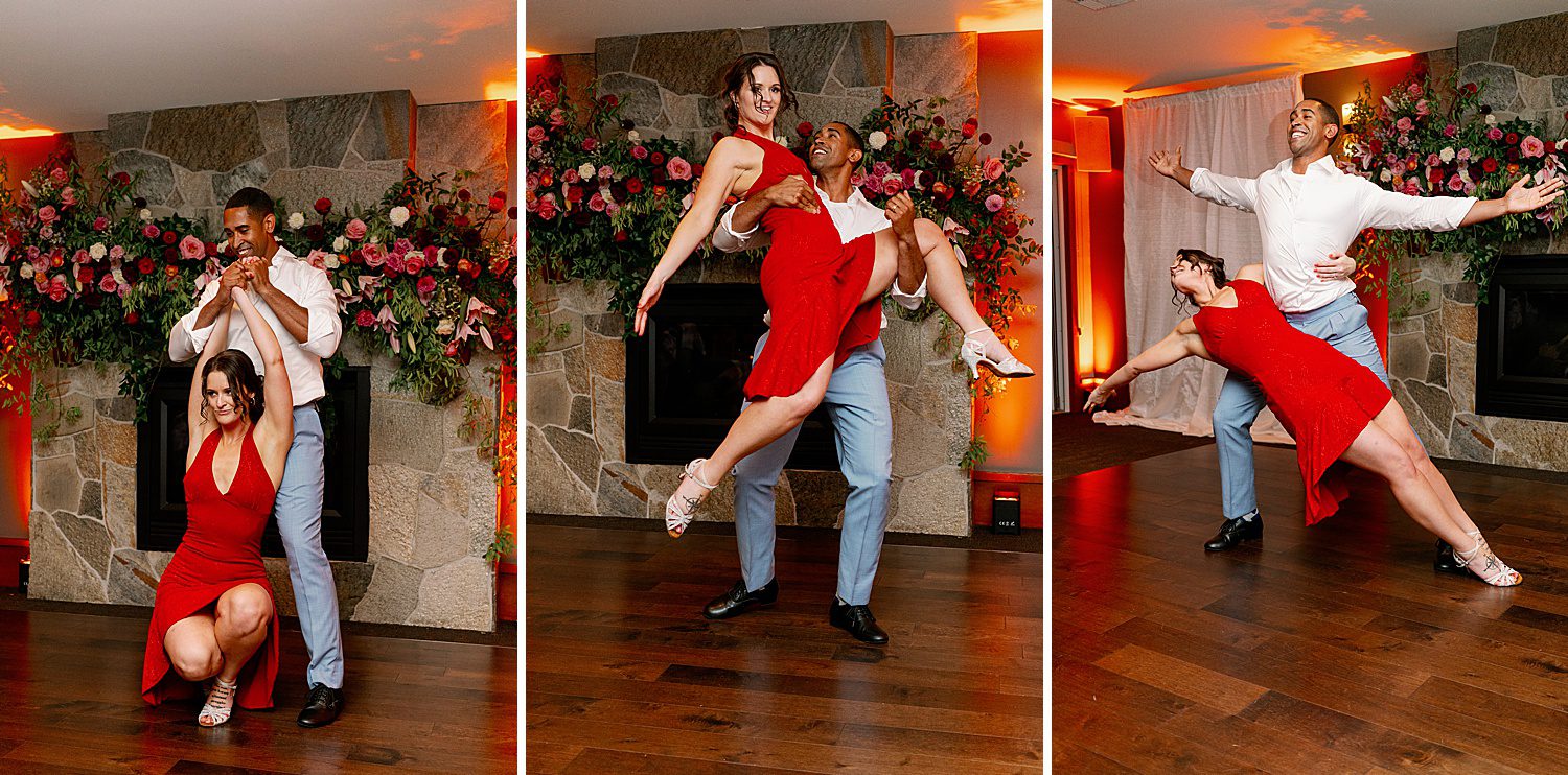 a man lifts and twirls a woman in a red dress during a wedding