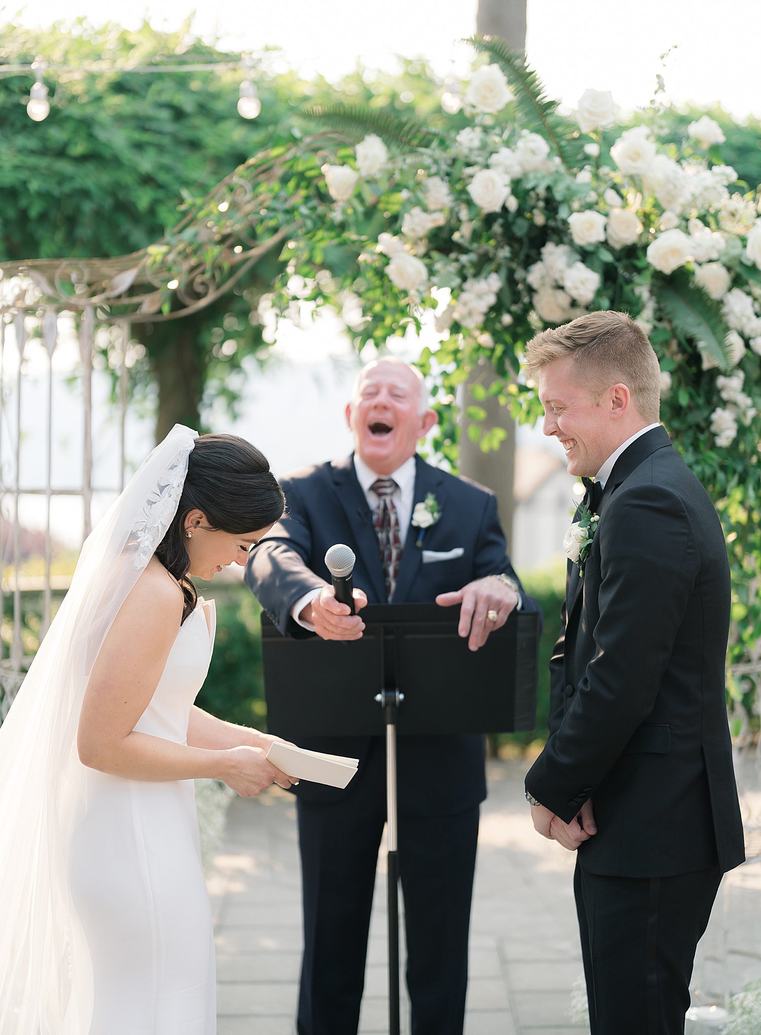 bride and groom laughing at the ceremony