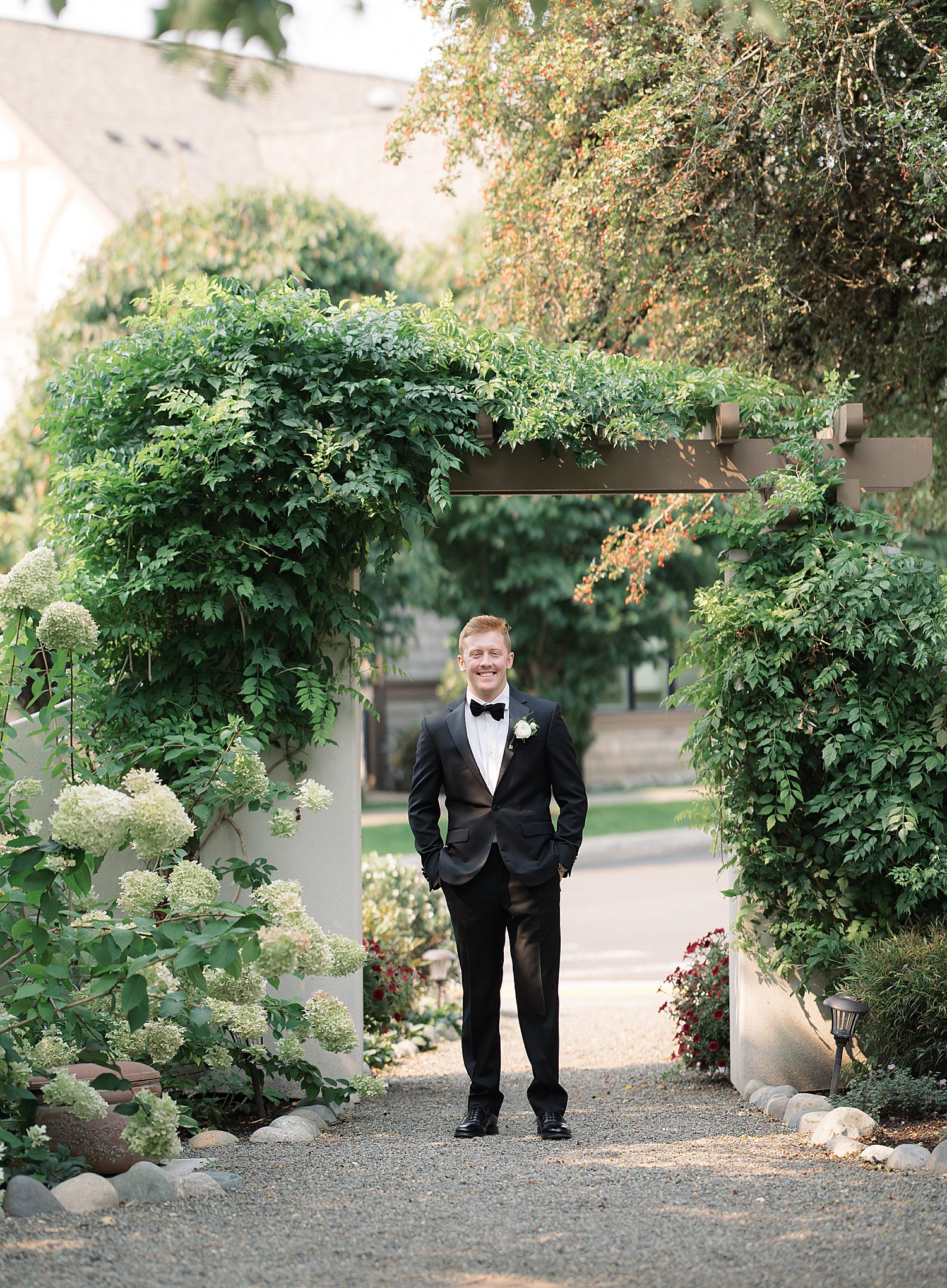 groom in a black tux