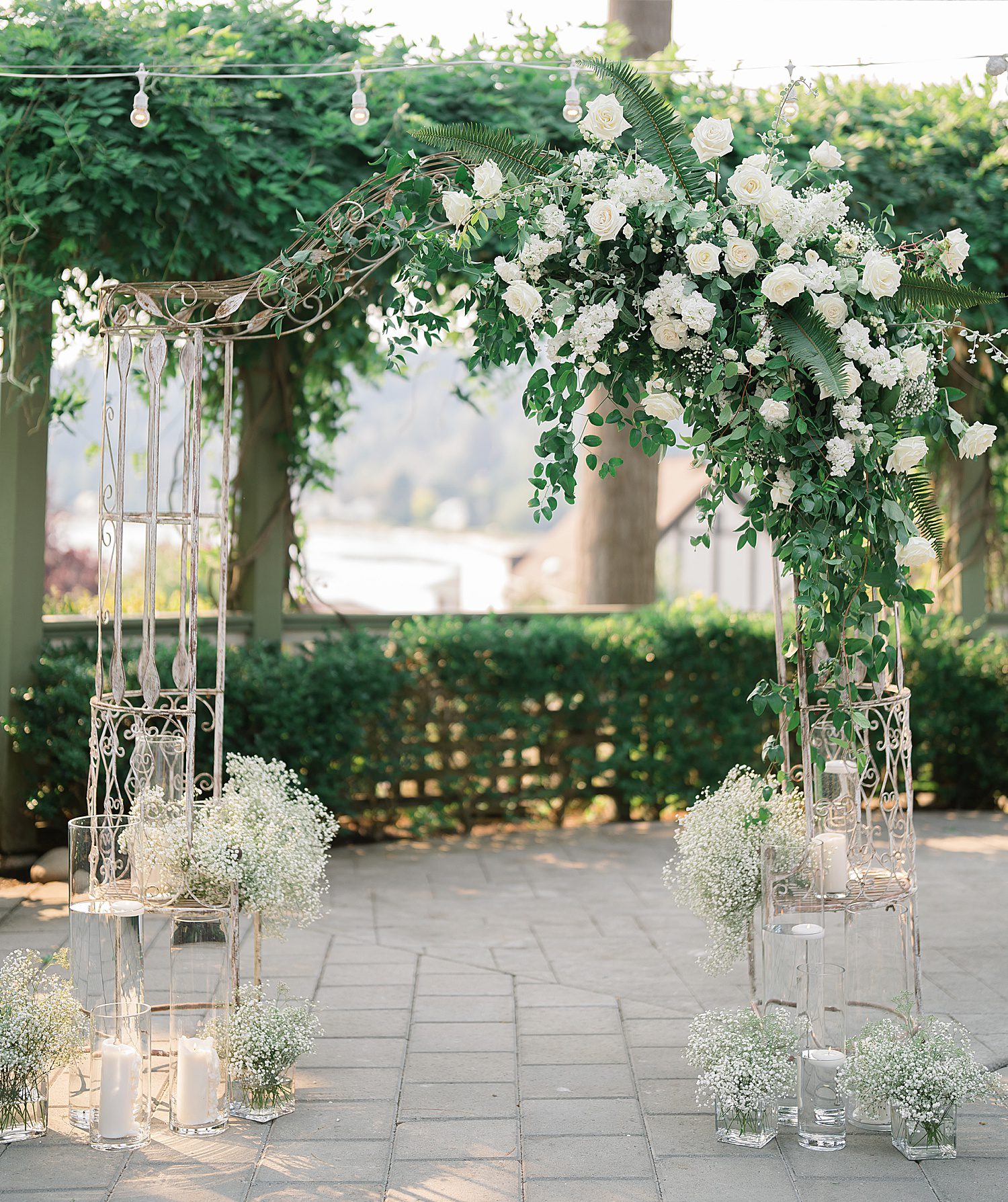 white flowers on a wedding arch