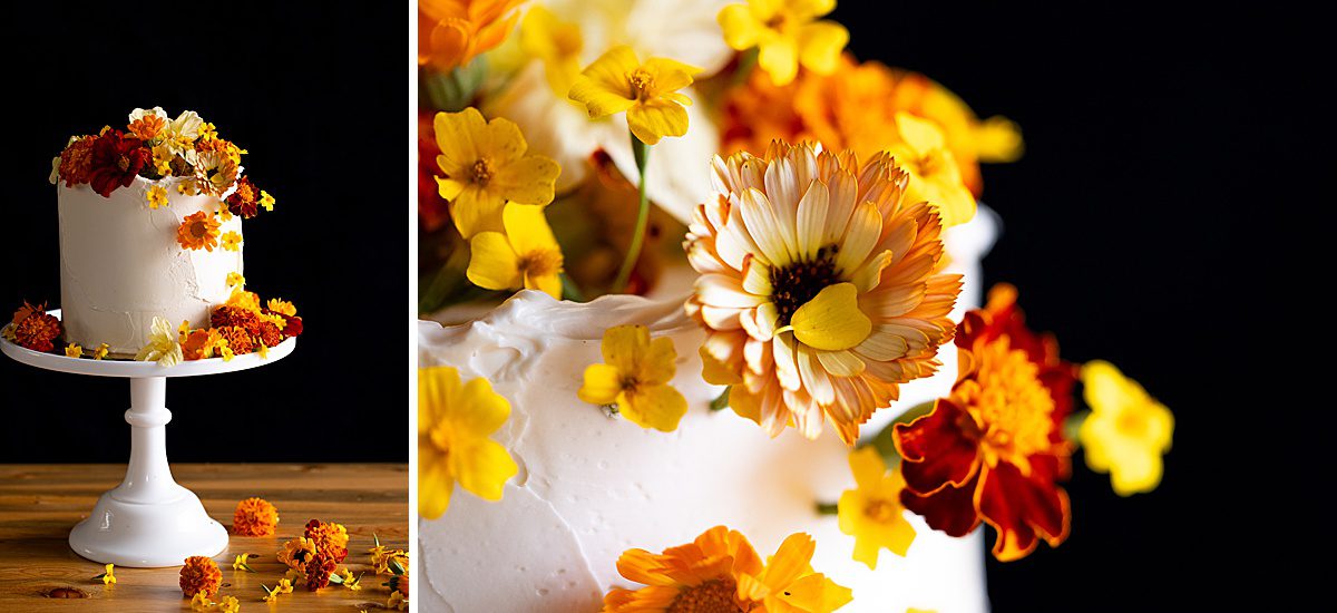 colorful edible flowers on a white cake