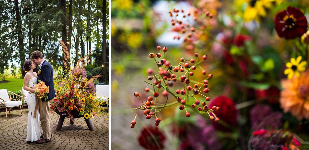 a bride and groom stand next to a fire pit with a fire made out of flowers