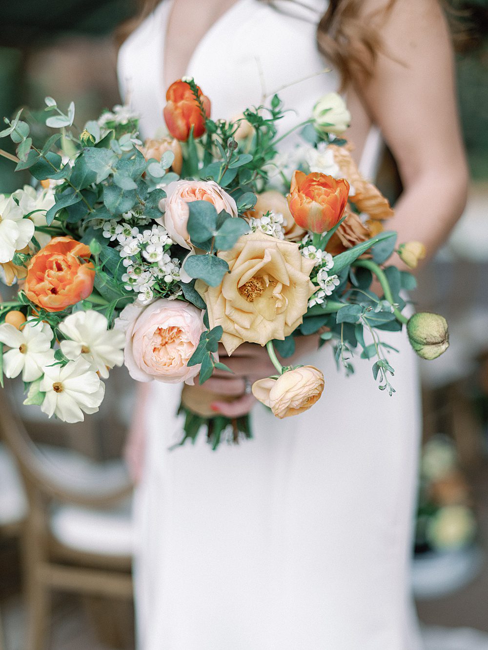 peach and sage green bridal bouquet with garden roses, ranunculus, tulips, and eucalyptus