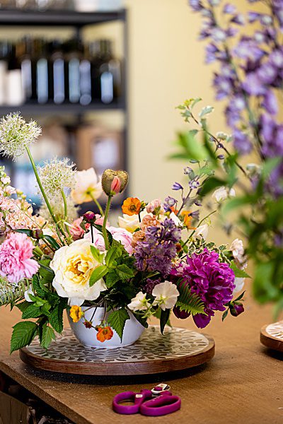 a colorful floral arrangement with peonies